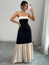 Two-Tone Spaghetti Strap Tiered Ruffle Hem Maxi Dress in black and cream by ALE AVENA – front view